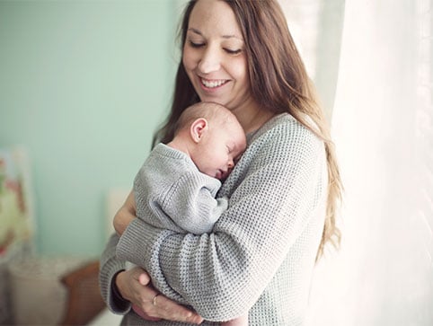 Holding a baby and bonding. CHM