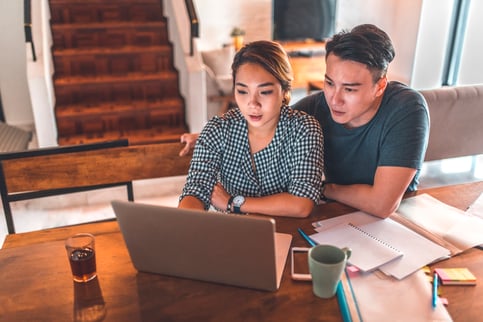 CHM. Couple planning budget together.